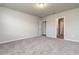 Well-lit bedroom with carpet and access to bathroom at 3285 Weitzel Dr, Haines City, FL 33844