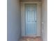 Light blue front door with keypad entry at 3285 Weitzel Dr, Haines City, FL 33844