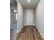 Long hallway with dark brown tile floors at 3285 Weitzel Dr, Haines City, FL 33844