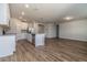 Open concept kitchen features stainless steel appliances and an island at 3285 Weitzel Dr, Haines City, FL 33844