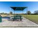 Picnic area with shaded tables and benches at 3285 Weitzel Dr, Haines City, FL 33844