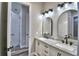 Stylish bathroom with marble countertop sinks and decorative lighting at 337 Doryman Way, Auburndale, FL 33823