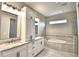 Bathroom with double vanity, marble countertop and garden tub at 337 Doryman Way, Auburndale, FL 33823