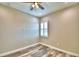 Well-lit bedroom featuring wood-look floors and window shutters at 337 Doryman Way, Auburndale, FL 33823