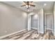 Bedroom with walk-in closet and wood-look floors at 337 Doryman Way, Auburndale, FL 33823