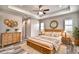 Stylishly decorated main bedroom featuring wood-look flooring, a decorative bed, and modern furniture at 337 Doryman Way, Auburndale, FL 33823