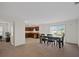 Dining area with table and chairs, kitchen partially visible at 347 Towns Circle, Haines City, FL 33844