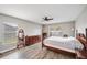 Main bedroom with wood-look floors and sliding doors at 359 Mandolin Ln, Winter Haven, FL 33884