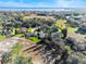 Aerial view of homes and landscape near a lake at 38 Grenewood Ln, Haines City, FL 33844