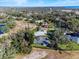 Aerial view of homes and landscape near a lake at 38 Grenewood Ln, Haines City, FL 33844