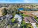 Aerial view of homes near a pond at 38 Grenewood Ln, Haines City, FL 33844