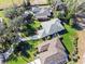 Aerial view of three homes with surrounding landscape at 38 Grenewood Ln, Haines City, FL 33844