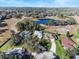 Aerial view of homes near a pond at 38 Grenewood Ln, Haines City, FL 33844