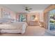 Main bedroom with king-size bed and access to patio at 38 Grenewood Ln, Haines City, FL 33844