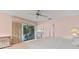 Main bedroom with king-size bed and view of the patio at 38 Grenewood Ln, Haines City, FL 33844