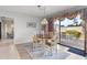 Charming dining room with table and access to the patio at 38 Grenewood Ln, Haines City, FL 33844