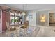Casual dining area with table for four and access to patio at 38 Grenewood Ln, Haines City, FL 33844
