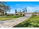 House exterior with a large front yard and driveway at 38 Grenewood Ln, Haines City, FL 33844