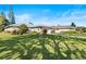 House exterior with a large yard and driveway at 38 Grenewood Ln, Haines City, FL 33844