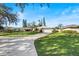 House exterior showcasing a spacious front yard and driveway at 38 Grenewood Ln, Haines City, FL 33844