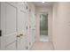 Hallway with two closets and access to a bathroom at 38 Grenewood Ln, Haines City, FL 33844