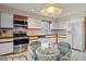 Bright kitchen with stainless steel appliances and breakfast nook at 38 Grenewood Ln, Haines City, FL 33844