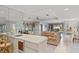 Living room with wet bar, sofa and view to backyard at 38 Grenewood Ln, Haines City, FL 33844