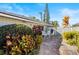 Private patio with seating area and lush landscaping at 38 Grenewood Ln, Haines City, FL 33844