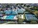 Aerial view of community pool, tennis courts, and clubhouse at 4062 Bedford Ave, Winter Haven, FL 33884