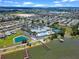 Aerial view showing community clubhouse, pool, and lake access at 4068 Carteret Dr, Winter Haven, FL 33884