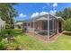 Screened patio and grassy backyard at 4068 Carteret Dr, Winter Haven, FL 33884