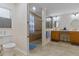 Large bathroom with double vanity, walk-in shower, and accessible features at 4068 Carteret Dr, Winter Haven, FL 33884