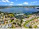 Aerial view of community with lake and clubhouse at 4068 Carteret Dr, Winter Haven, FL 33884