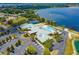 Community clubhouse with pool, tennis, and basketball courts at 4068 Carteret Dr, Winter Haven, FL 33884