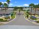 Community entrance with lush landscaping and gates at 4068 Carteret Dr, Winter Haven, FL 33884