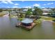 Lakeside gazebo with wooden deck and metal roof at 4068 Carteret Dr, Winter Haven, FL 33884
