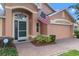 Welcoming front entrance featuring a green door and brick walkway at 4068 Carteret Dr, Winter Haven, FL 33884