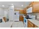 Well-equipped kitchen boasting modern appliances and light wood cabinets at 4068 Carteret Dr, Winter Haven, FL 33884