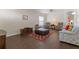 Living room with dark hardwood floors, comfy furniture, and a ceiling fan at 4068 Carteret Dr, Winter Haven, FL 33884