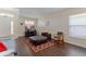 Spacious living area featuring hardwood floors, a large TV, and ample natural light at 4068 Carteret Dr, Winter Haven, FL 33884