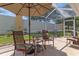 Outdoor patio furniture under an umbrella at 4068 Carteret Dr, Winter Haven, FL 33884