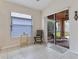 Sunroom with tiled floors, sliding glass doors, and access to the backyard at 4068 Carteret Dr, Winter Haven, FL 33884