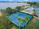 Well-maintained tennis and pickleball courts near the lake at 4068 Carteret Dr, Winter Haven, FL 33884