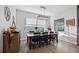 Bright dining room featuring a rustic wooden table and six chairs at 4462 Micanope Crescent Dr, Lakeland, FL 33811