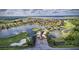 Aerial view of Lake Ashton community with a lake and golf course at 4489 Strathmore Dr, Lake Wales, FL 33859