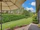 Landscaped backyard with lush greenery and spacious lawn at 4489 Strathmore Dr, Lake Wales, FL 33859