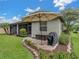 Enjoy this well-manicured backyard with patio and grill at 4489 Strathmore Dr, Lake Wales, FL 33859