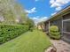Spacious backyard with lush landscaping and privacy hedge at 4489 Strathmore Dr, Lake Wales, FL 33859