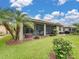 Private backyard oasis with screened lanai and lush landscaping at 4489 Strathmore Dr, Lake Wales, FL 33859