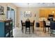 Kitchen dining area with table and chairs, near sliding doors to the patio at 4489 Strathmore Dr, Lake Wales, FL 33859